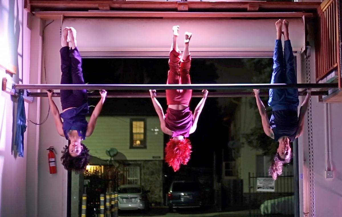 Megan Lowe DancesMegan Lowe, Sonsherée Giles, and Shira Yaziv hang upside-down during Megan Lowe Dances presents Action Potential - Photo by John Carnahan