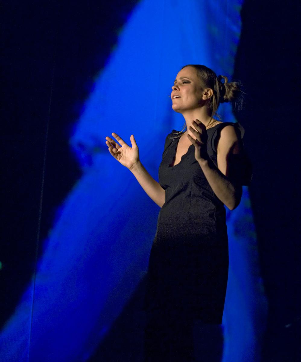 Sara Kraft wearing a black dress, which was a costume in the production, "HyperReal."